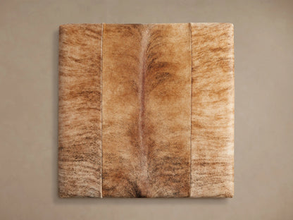 Rectangular Tilton Hair on Hide Ottoman, blonde brindle with patchwork seams, on slender gold metal legs.