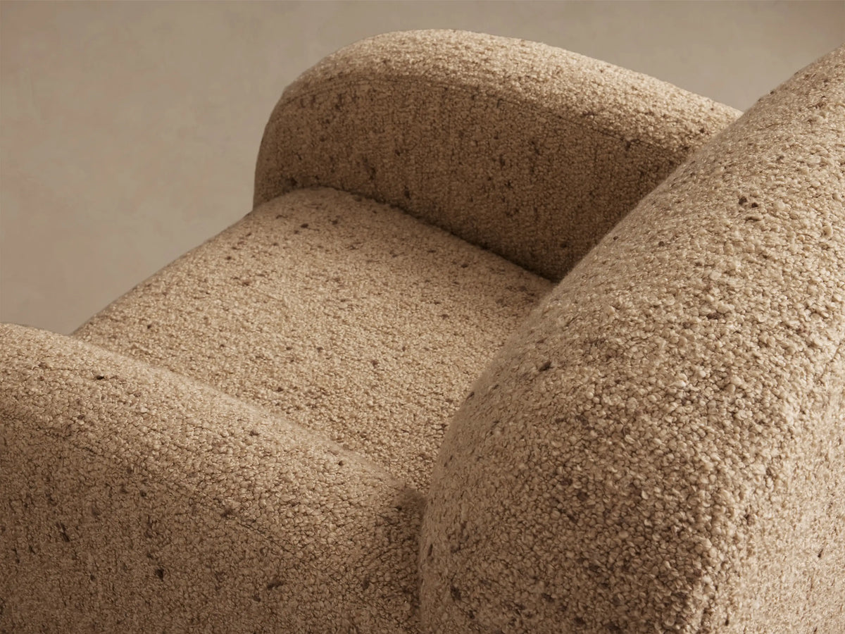 Front view of the light brown boucle Algiers Swivel Chair, featuring a modern rounded design.