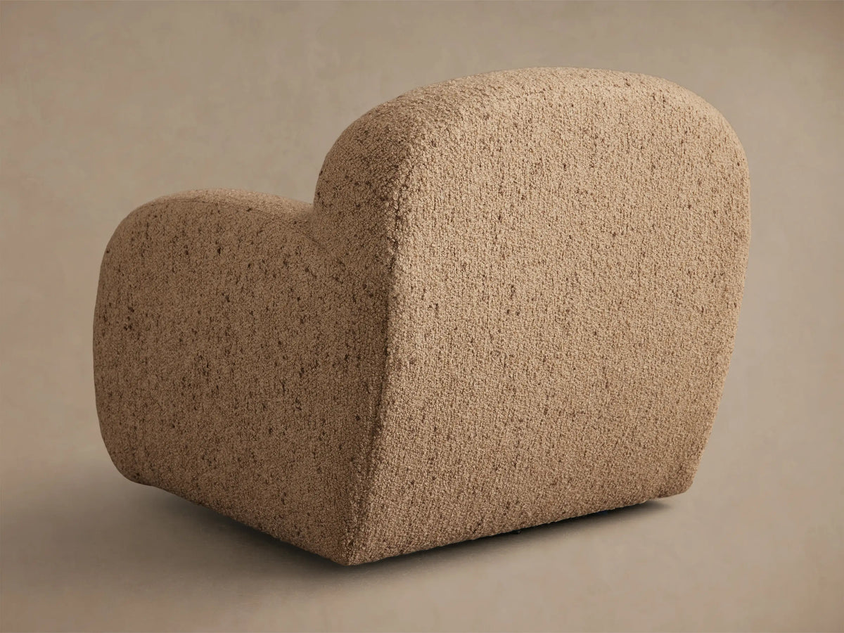 Front view of the Beige Algiers Swivel Chair, featuring rounded arms and a textured bouclv© upholstery.