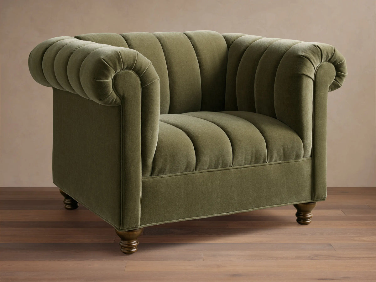 Front view of a green Berwick Channeled Chair with channel-stitched back and seat, rolled arms, and wooden feet.