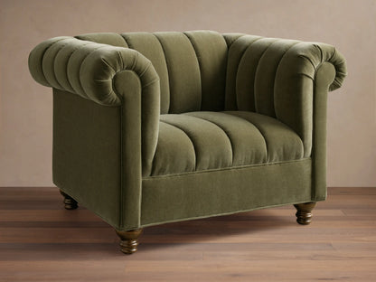 Front view of a green Berwick Channeled Chair with channel-stitched back and seat, rolled arms, and wooden feet.