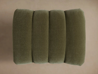Close-up of the Olive Berwick Channeled Ottoman, showing channeled velvet top and dark turned wood legs.