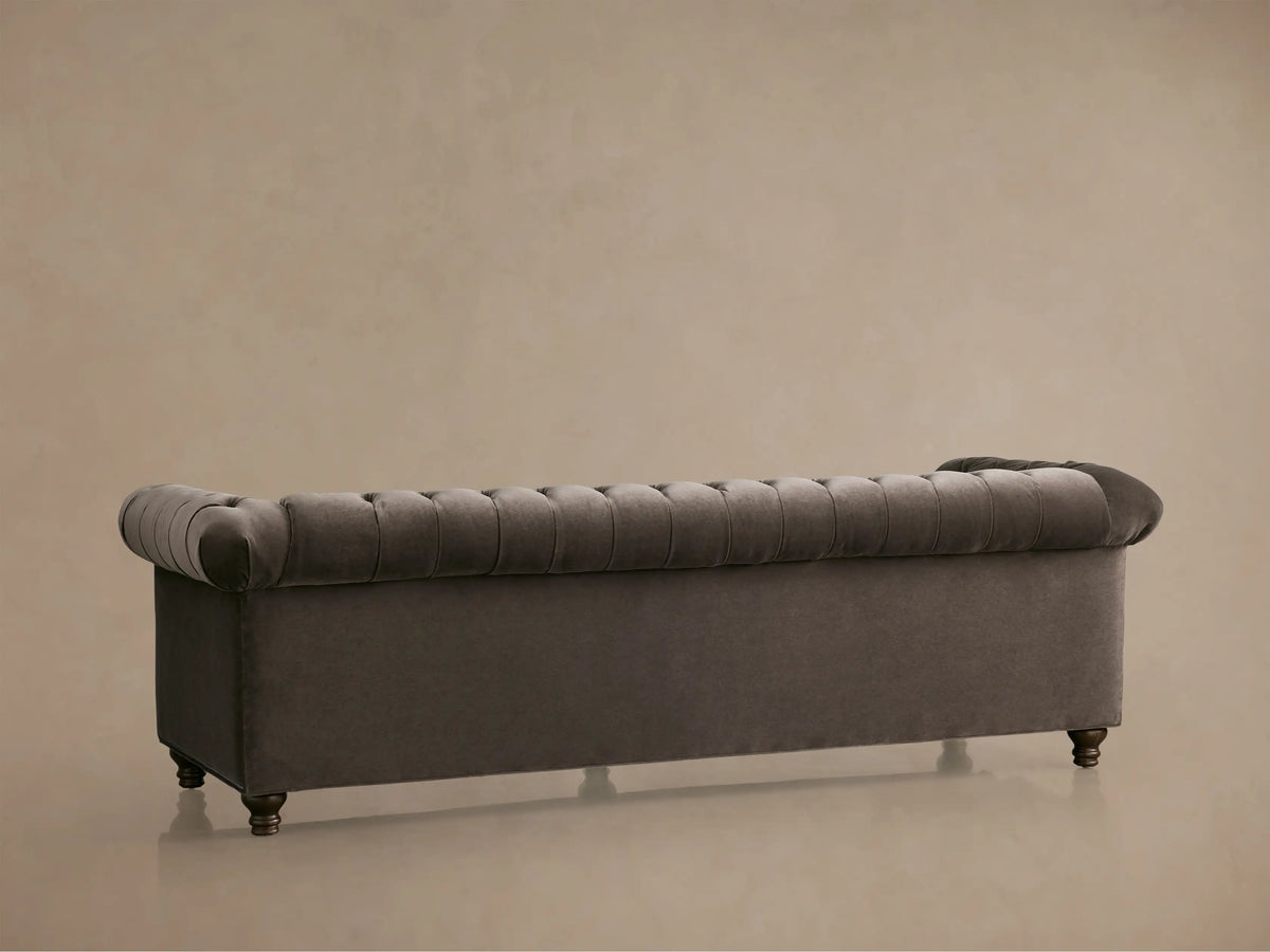 Berwick Sofa, dark mink velvet, close-up angled view of deep tufting on back and seat, with a rolled armrest.