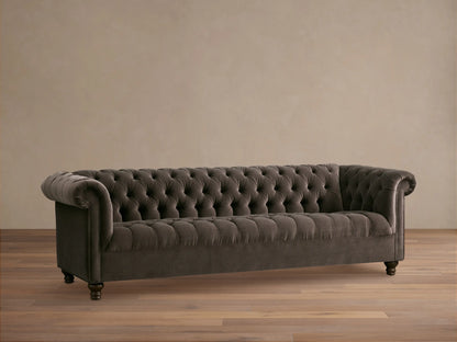 Berwick Sofa: Dark mink velvet Chesterfield sofa with deep button tufting, rolled arms, and carved wooden feet.