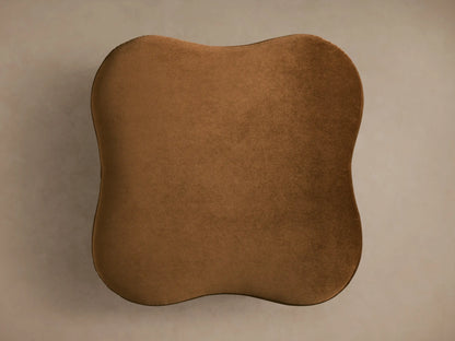 Top-down view of a plush brown Barbey Ottoman with an organic, irregular shape.