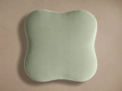 Top view of light sage green Barbey Ottoman with Fringe, showcasing its rounded, irregular cushion surface.