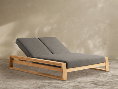 Canyon Outdoor Teak Double Chaise with a light natural wood frame and two grey separate adjustable back cushions, front-right view.