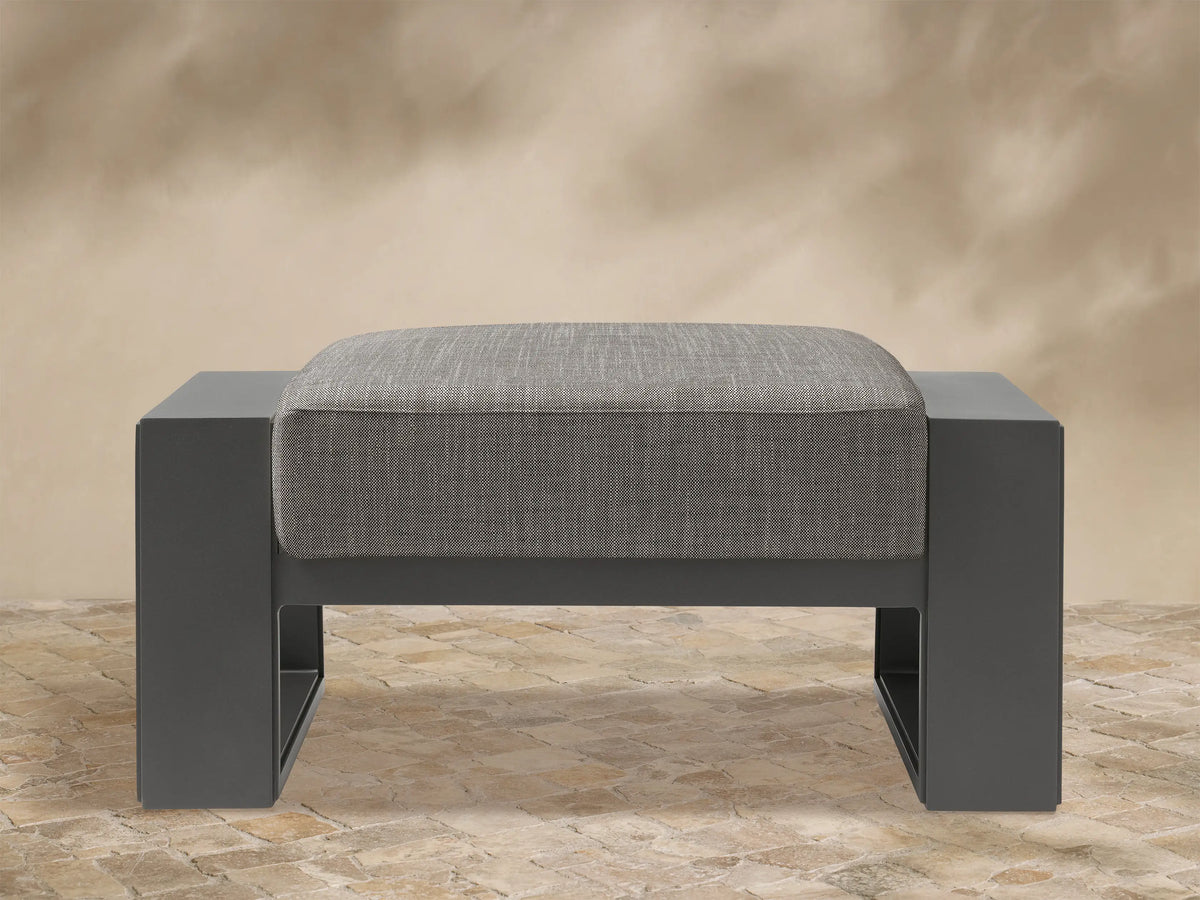 Canyon Outdoor Aluminum Ottoman: dark gray rectangular frame with a light gray textured, square cushion, shown front view.