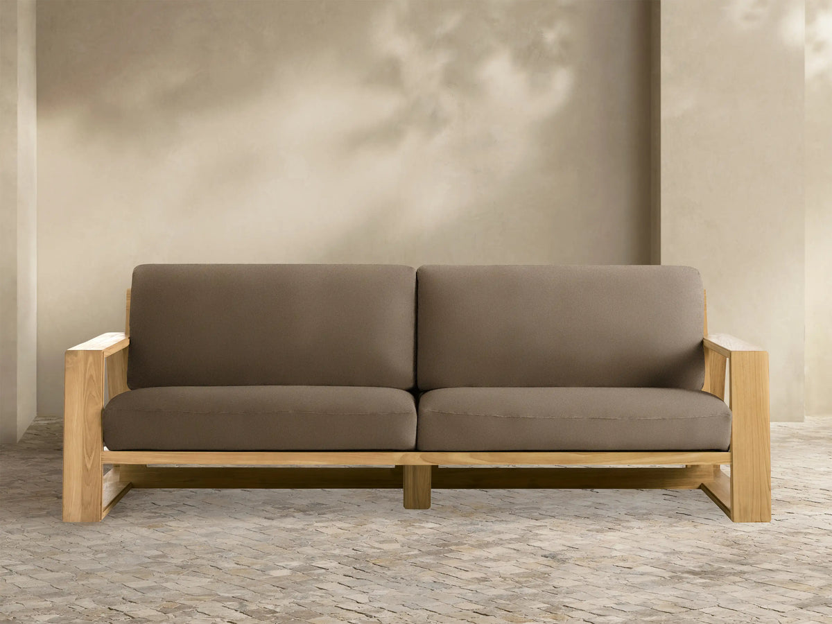 Canyon Outdoor Teak Sofa, 2-seater, with light wood frame and dark brown cushions, front view on white background.