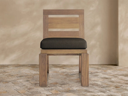 Canyon Outdoor Teak Dining Side Chair, front view. Natural teak frame with two horizontal slats, and a dark brown cushion.