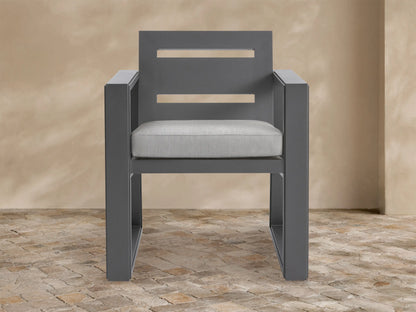 Front view of Canyon Outdoor Aluminum Dining Arm Chair. Dark gray aluminum frame with two back slats, light gray cushion.
