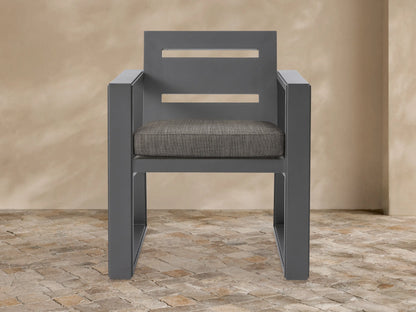 Front view of a dark gray Canyon Outdoor Aluminum Dining Arm Chair with two horizontal back slats and a mottled brown seat cushion.