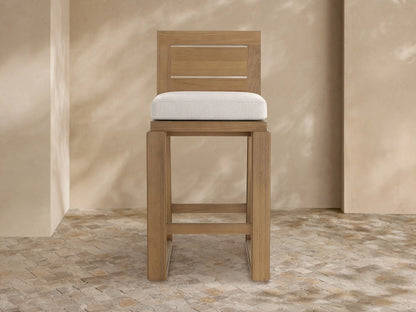 Canyon Outdoor Teak Barstool, light brown teak wood with slatted backrest and light beige upholstered seat cushion, front view.
