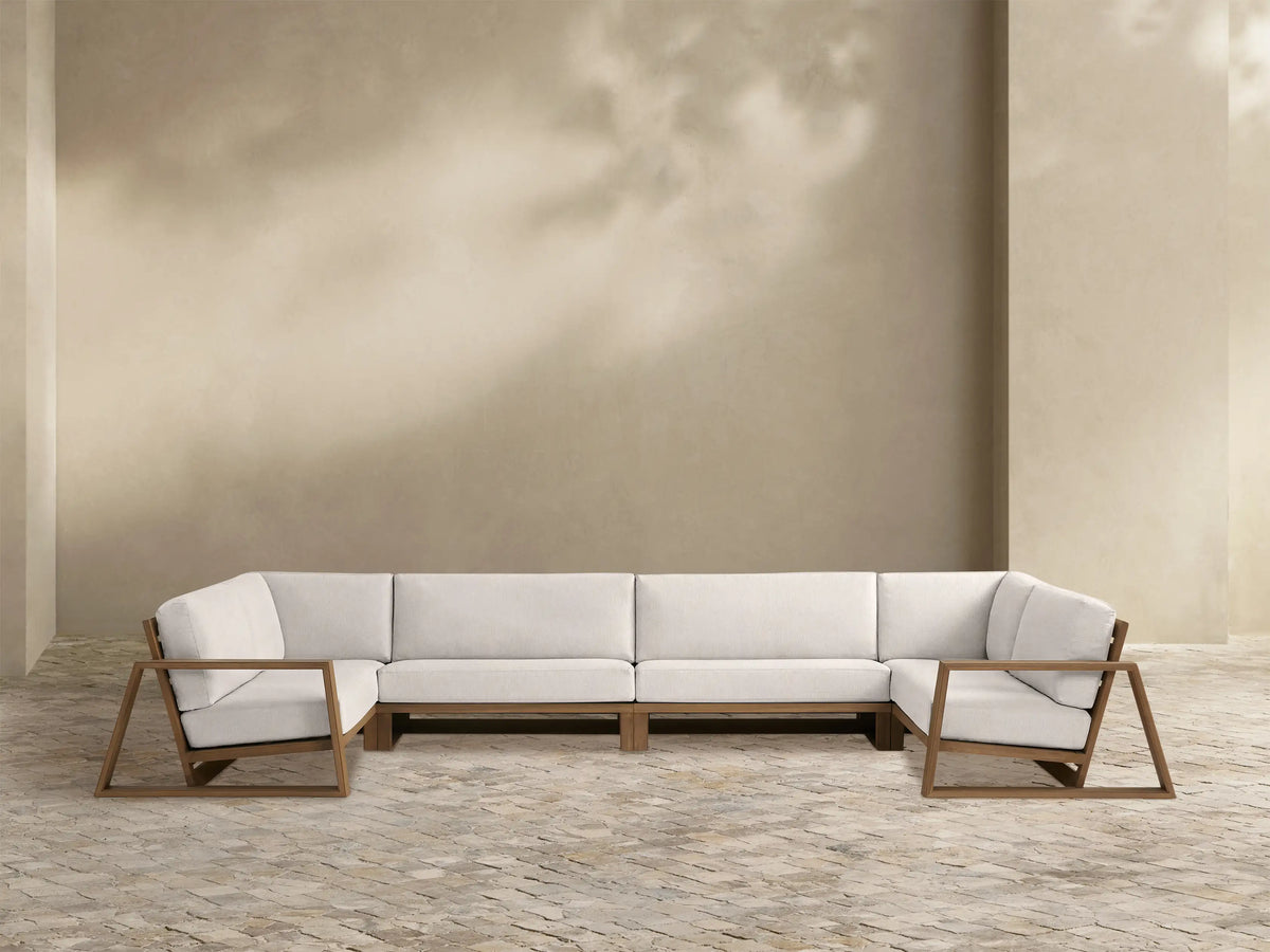 Canyon Outdoor Teak Four-Piece Sectional, U-shaped with off-white cushions & geometric weathered fawn teak frame, white background.