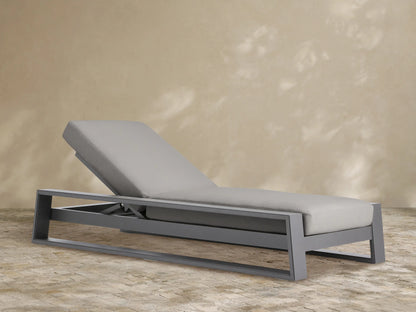 Canyon Outdoor Aluminum Chaise, dark grey frame, light grey cushions. Modern design, backrest elevated. Product shot.