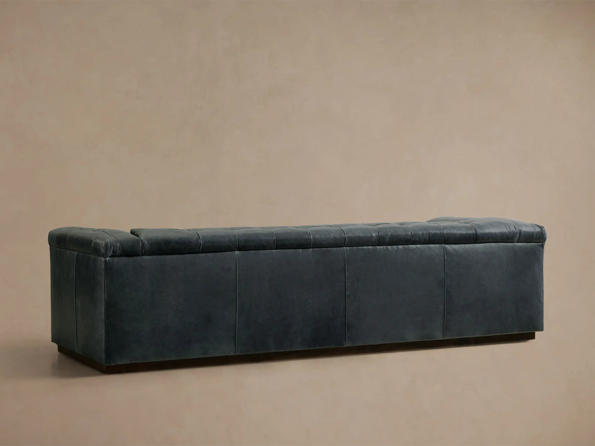 Front view of the Slate blue Cameran Leather Sofa with tufted back and arms.