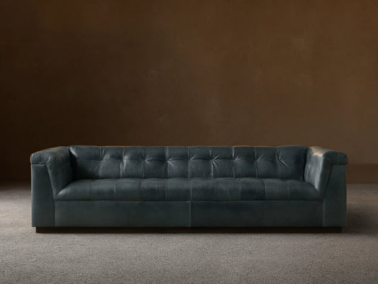 Front view of the Slate blue Cameran Leather Sofa with tufted back and arms.