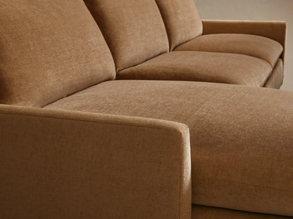 Calistoga Two-Piece Chaise Sectional in light brown fabric, featuring a left-side chaise and three-seat cushions with matching backrests on wooden flooring.