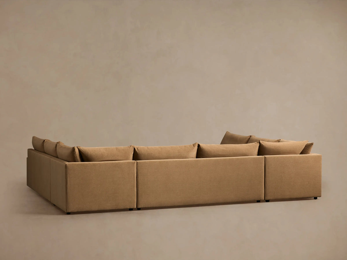 Calistoga Five-Piece Sectional in beige fabric; L-shaped design with plush cushions and square arms on a neutral background.