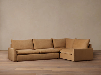 Calistoga Two-Piece Sectional in light brown fabric, featuring three seat cushions and an L-shaped design on a wooden floor.