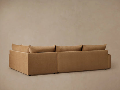 Calistoga Two-Piece Sectional in light brown fabric, showing soft cushions, sleek armrest, and slightly wrinkled relaxed design.