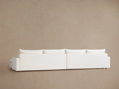 Calistoga 4-piece L-shaped sectional in white fabric, deep-seated, with plush cushions & chaise, on wood floor.