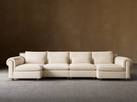 Calistoga Four-Piece Sectional in off-white, with left and right chaises, against a neutral brown wall and wood floor.