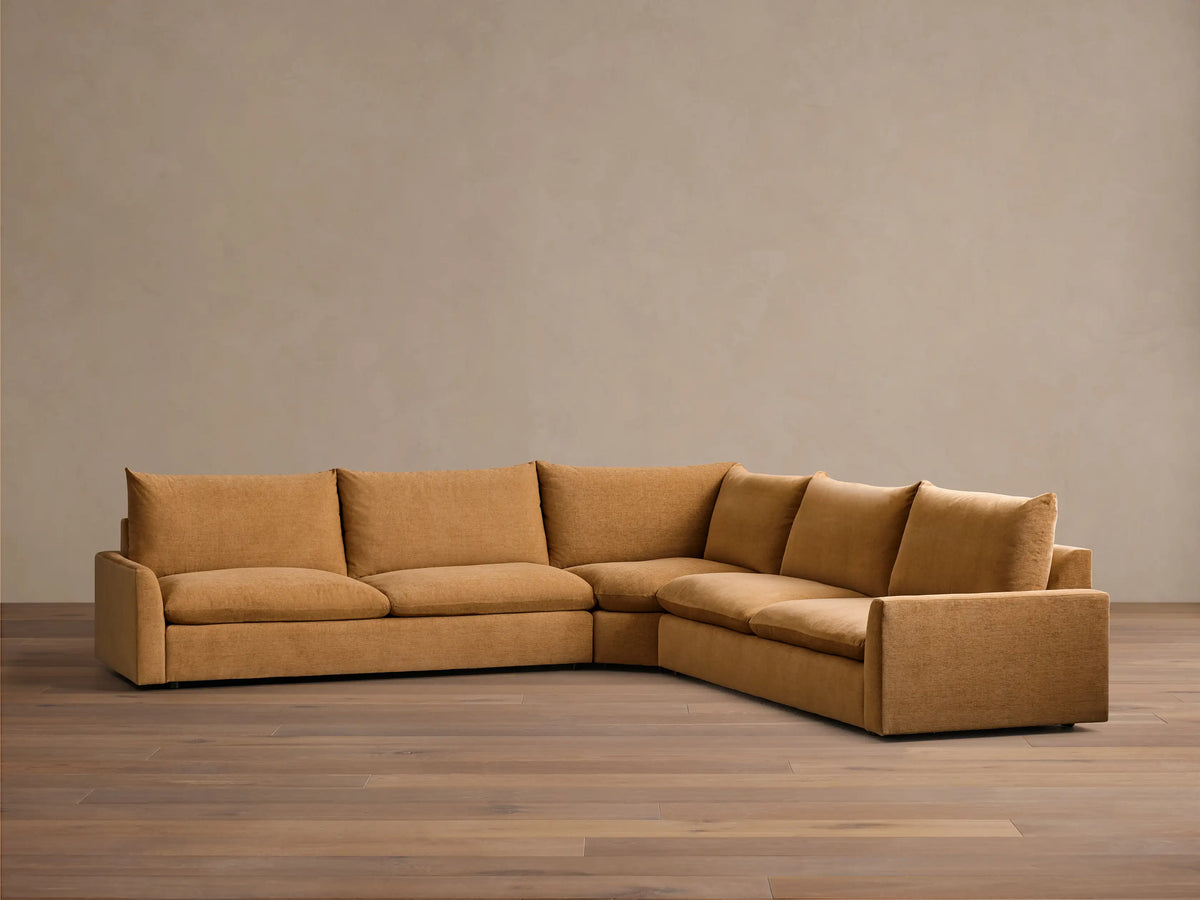Front view of the Ochre Calistoga Three-Piece Corner Wedge Sectional, with deep seats and plush back cushions.