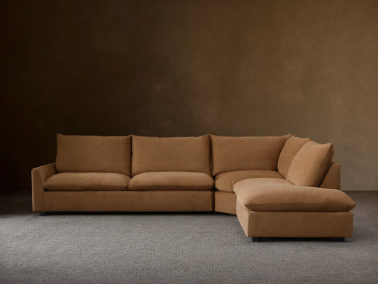 Front view of the Tan Calistoga Three-Piece Bumper Sectional, showcasing its L-shaped configuration.