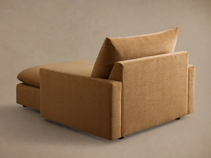 Side profile of a tan Calistoga Chaise with deep, plush seat and back cushions, showcasing its casual comfort.