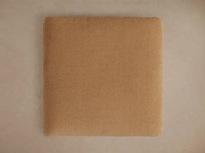 Calistoga Ottoman in a soft brown fabric, showing its smooth, slightly textured surface with a casual, relaxed look.