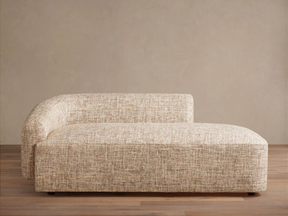 Hamlin Daybed: Modern armless chaise lounge in light beige textured fabric, with a curved backrest on the left.