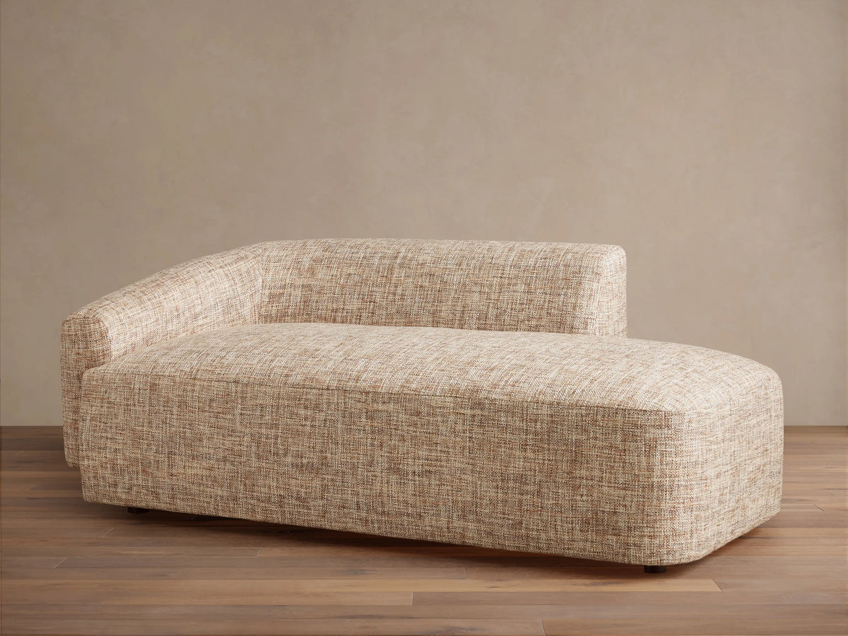Close-up of Hamlin Daybed's textured light brown and cream woven fabric upholstery, showing backrest and cushion detail.