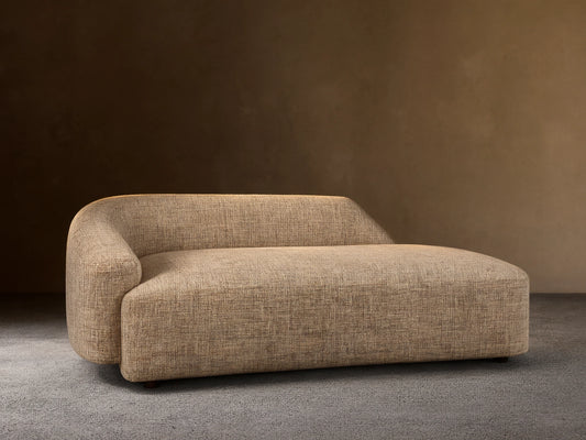 Hamlin Daybed: Modern armless chaise lounge in light beige textured fabric, with a curved backrest on the left.