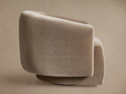 Hamlin Swivel Chair, light beige plush fabric, rounded back and side view, showing its dark, recessed swivel base.