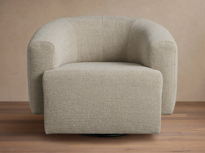 Two Mustard Hamlin Swivel Chairs with rounded backs, positioned in a living room with a patterned sofa and coffee table.