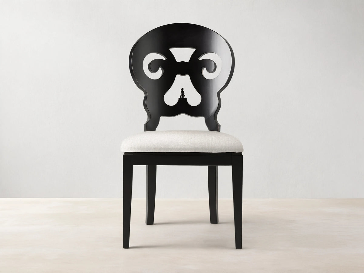 Jordan Dining Side Chair in Midnight; black wood frame with ornate back design, white padded seat, on white background.