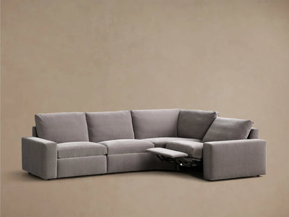 Front view of the gray Kipton Wide Arm Four-Piece Motion Sectional with wide arms and two footrests extended.