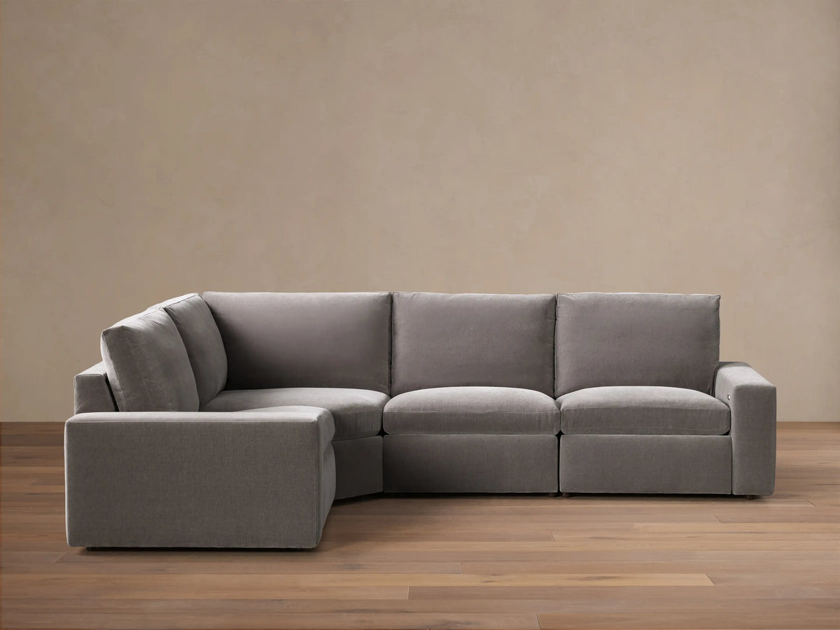 Kipton Wide Arm Four-Piece Motion Sectional