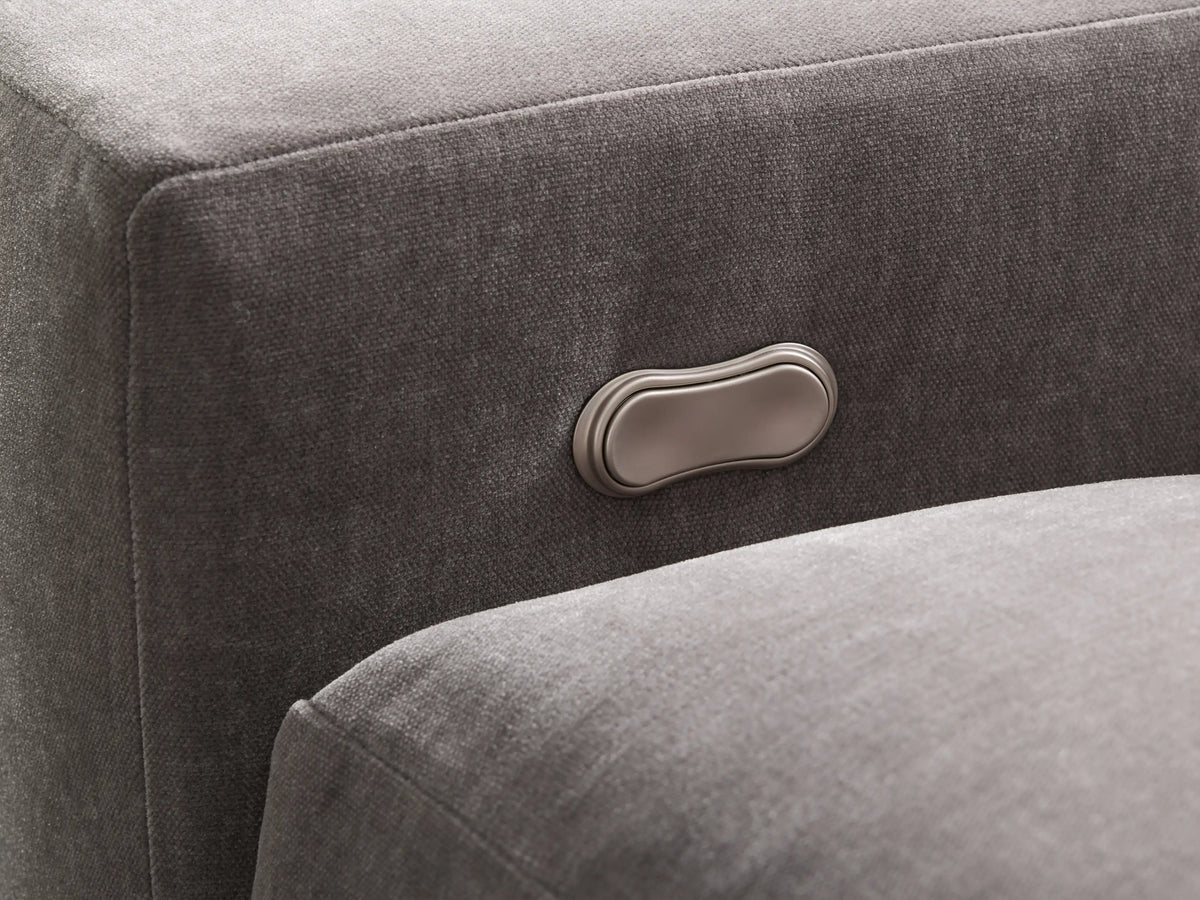 Front view of the light grey Kipton Wide Arm Four-Piece Motion Sectional arranged in an L-shape with wide arms.