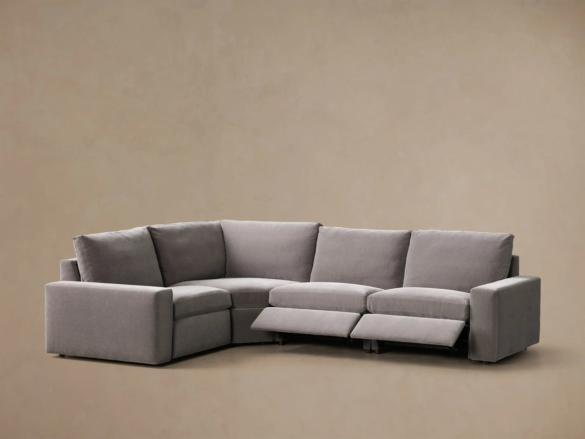 Rear view of the Grey Kipton Wide Arm Four-Piece Motion Sectional™ showing its four connected back sections and wide arms.