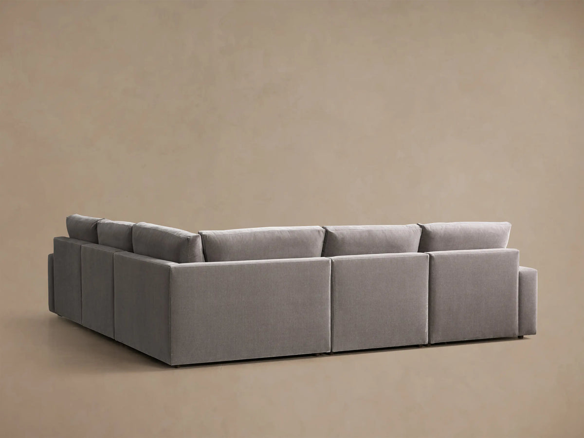 Rear view of the Grey Kipton Wide Arm Five-Piece Motion Corner Sectional.