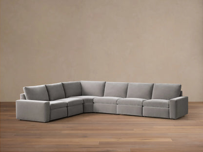 Front view of the gray Kipton Wide Arm Six Piece Motion Sectional, arranged in an L-shape with wide arms.