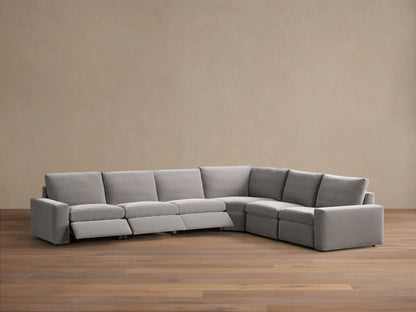 Rear view of a light grey Kipton Wide Arm Six Piece Motion Sectional, showing its L-shaped modular design.