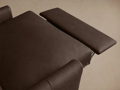 Close-up view of Kipton Leather Motion Recliner armrest, showcasing a smooth brown leather finish and a sleek silver oval control button.