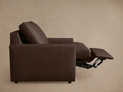 Brown leather recliner partially reclined, showing cushioned seat, extended footrest, and slim armrests, viewed from above.