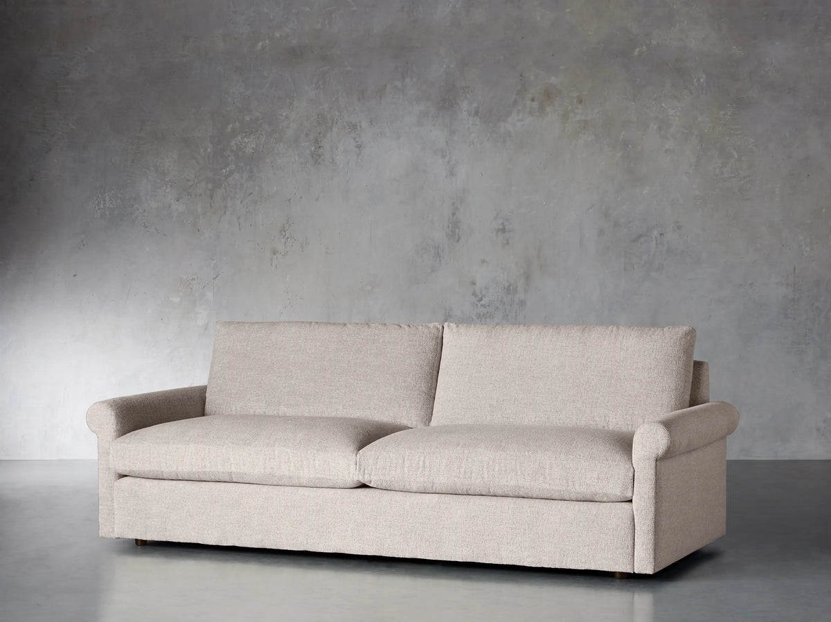 Front view of the beige textured Kipton Rolled Arm Sofa, featuring two seat cushions, two back cushions, and rolled arms.