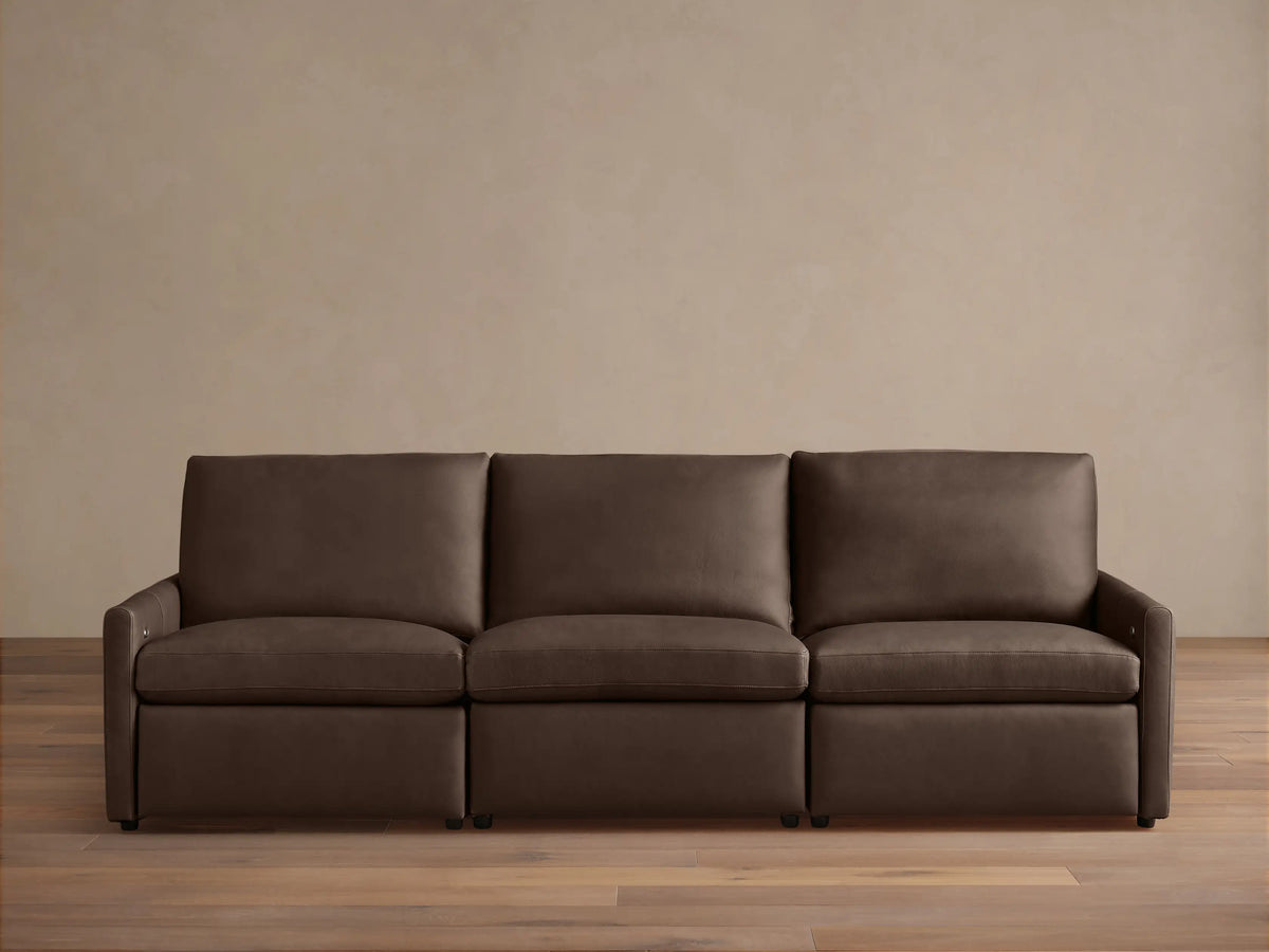 Three-piece Kipton Leather Modular Sofa with slim arms and a sleek design in dark brown leather against a neutral background.