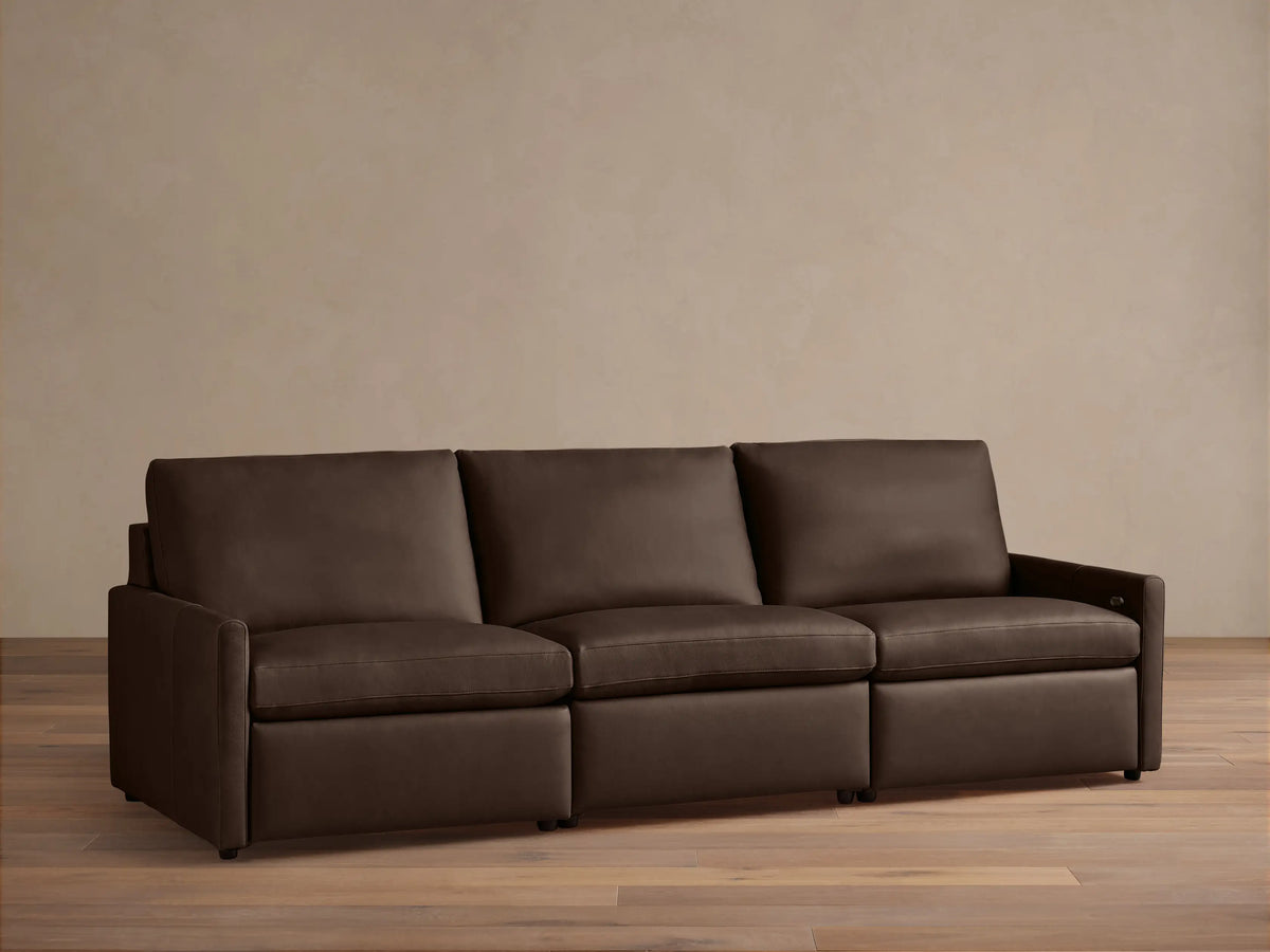 Three-piece Kipton Leather Modular Sofa with slim arms and a sleek design in dark brown leather against a neutral background.