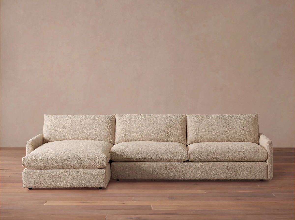 Kipton Slim Arm Two-Piece Chaise Sectional in light beige, featuring a left-facing chaise and plush cushions.